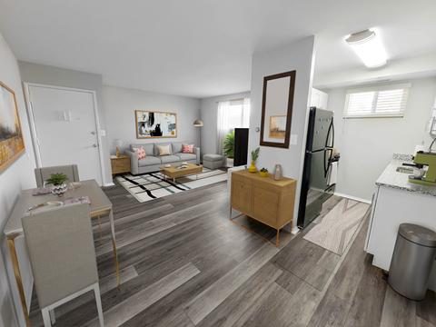 a spacious living room with hardwood flooring and white walls